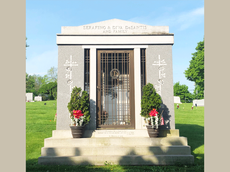 Pictured here is a completely custom 9 crypt granite private family walk-in mausoleum designed and installed in a local cemetery by Rome Monument