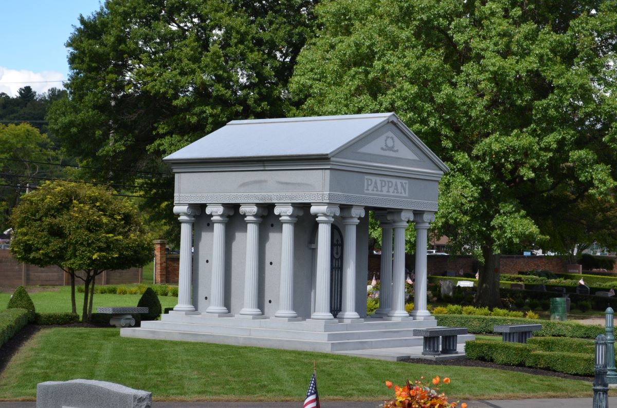 A Greek Neoclassical style private family mausoleum designed by Rome Monument mausoleum architects, Vince and John Dioguardi, is the Pappan family mausoleum shown here.