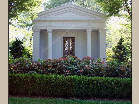 Pictured here is a majestic private walk-in chapel style family estate mausoleum designed and built with Rock of Ages granite by Rome Monument. 